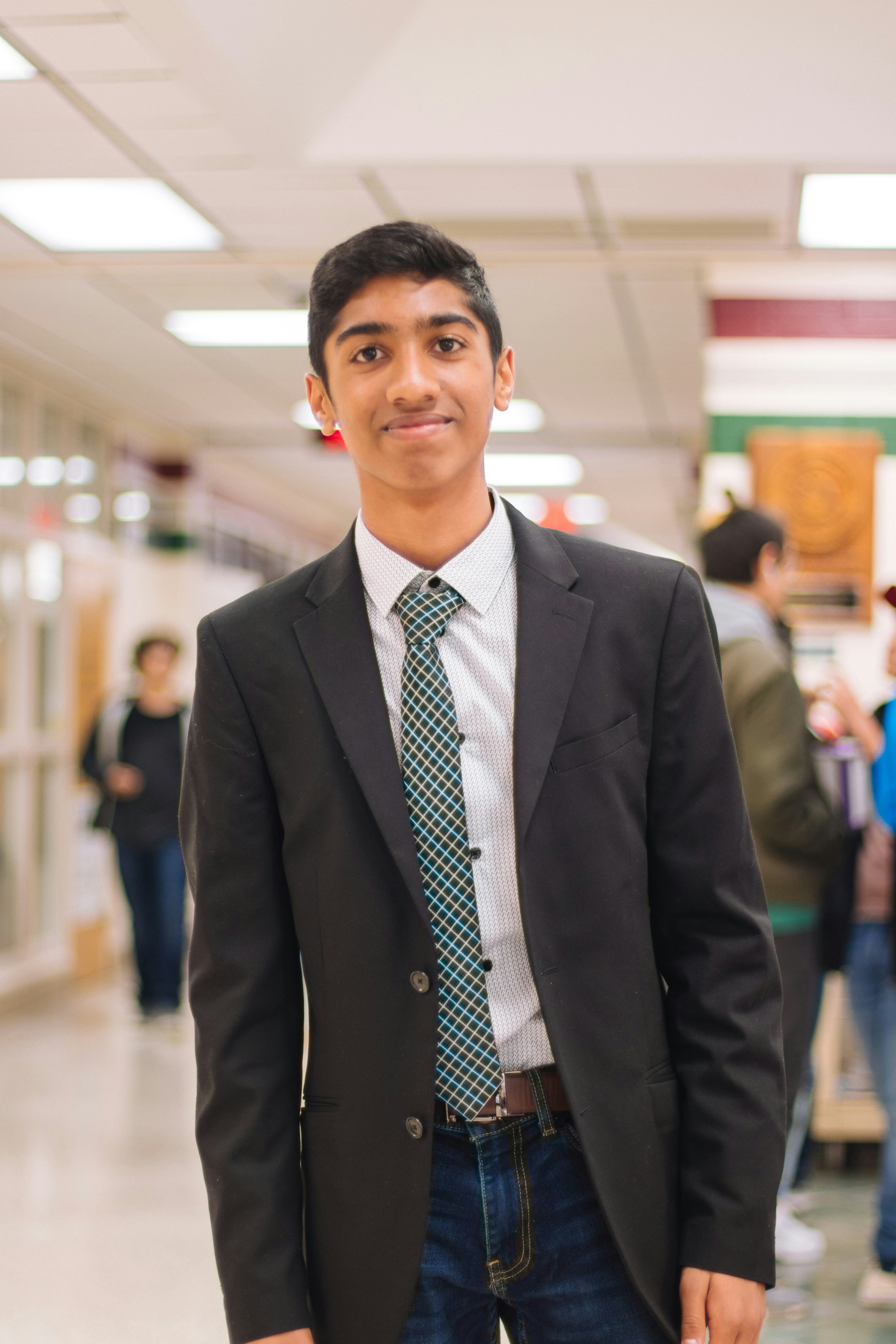 man in black suit jacket standing